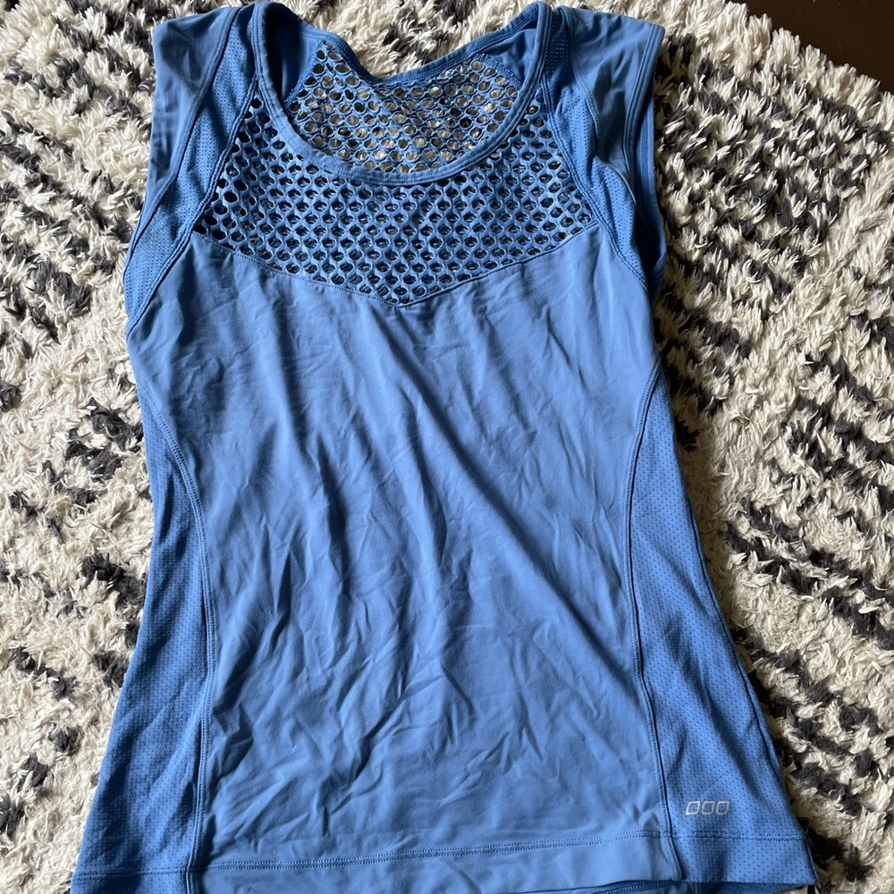 Blue workout top with see through details